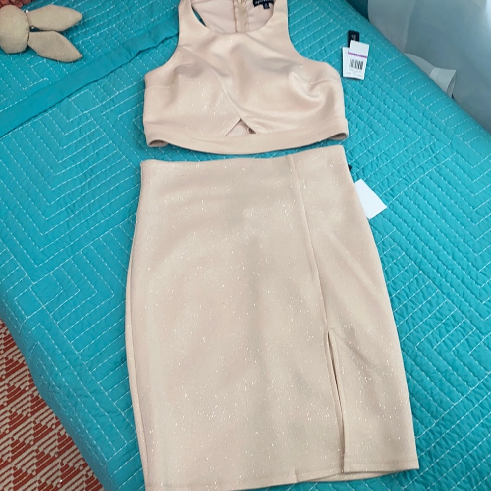 Two piece skirt suit.